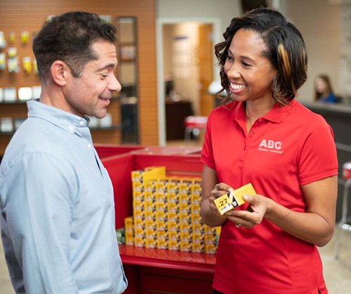 Manager in training speaking with customer